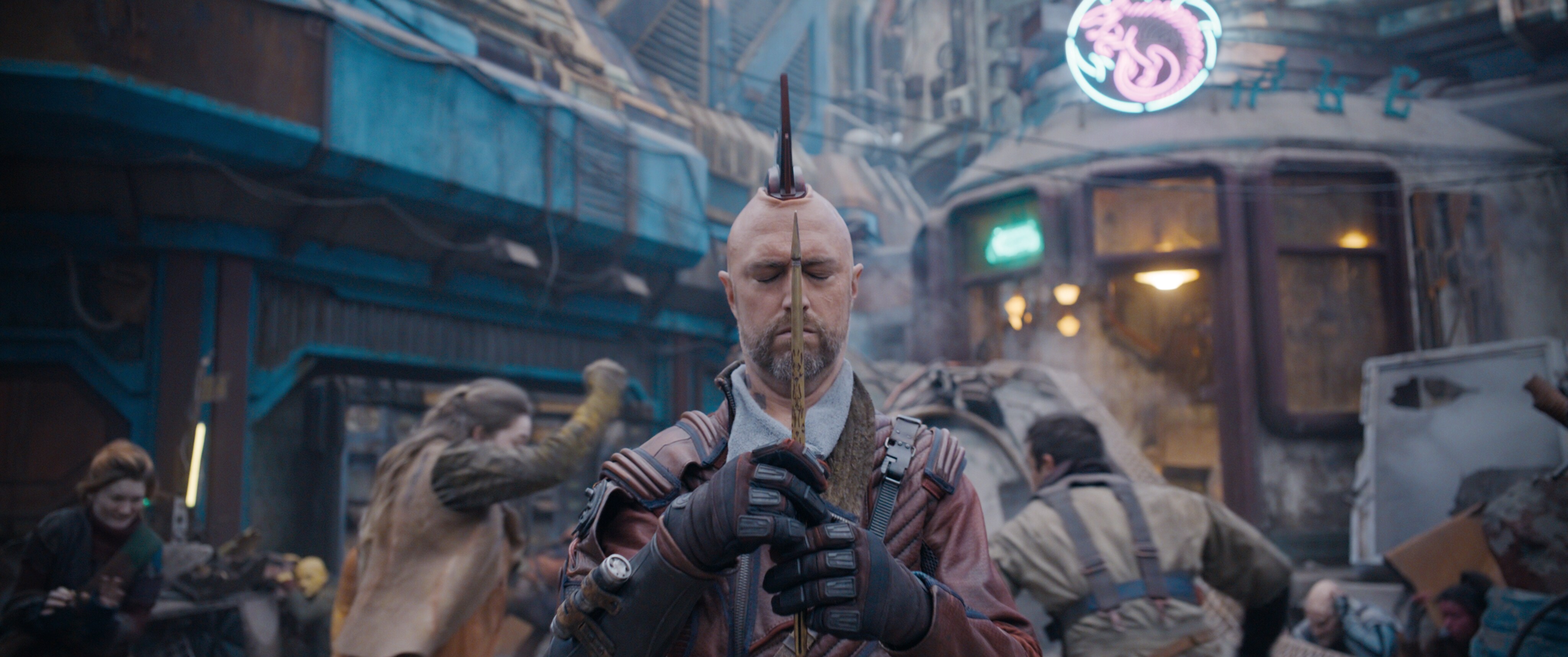 Kraglin, eyes closed, focuses on the arrow he holds in front of him