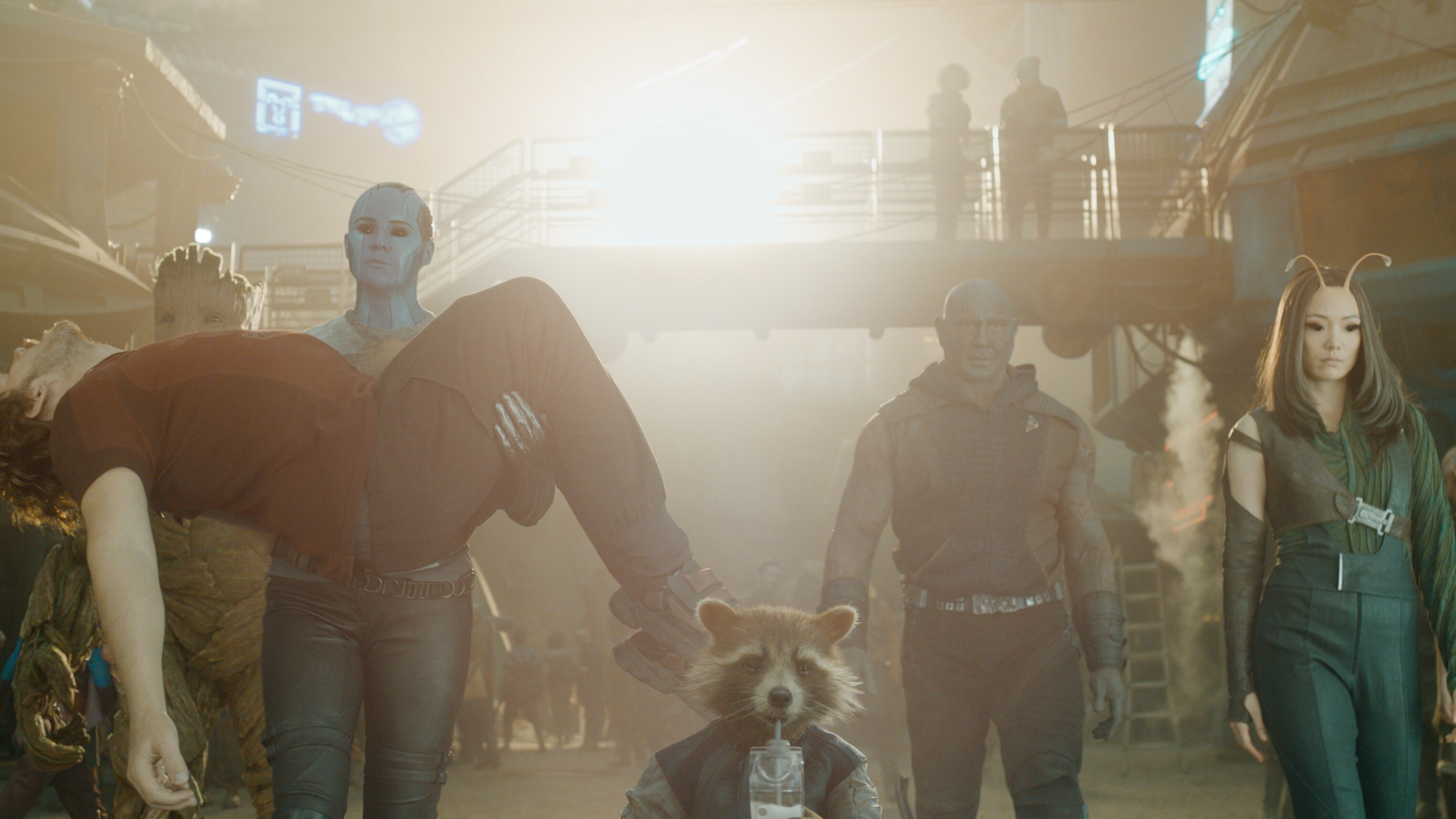 Nebula holding Quill, walking with the other guardians