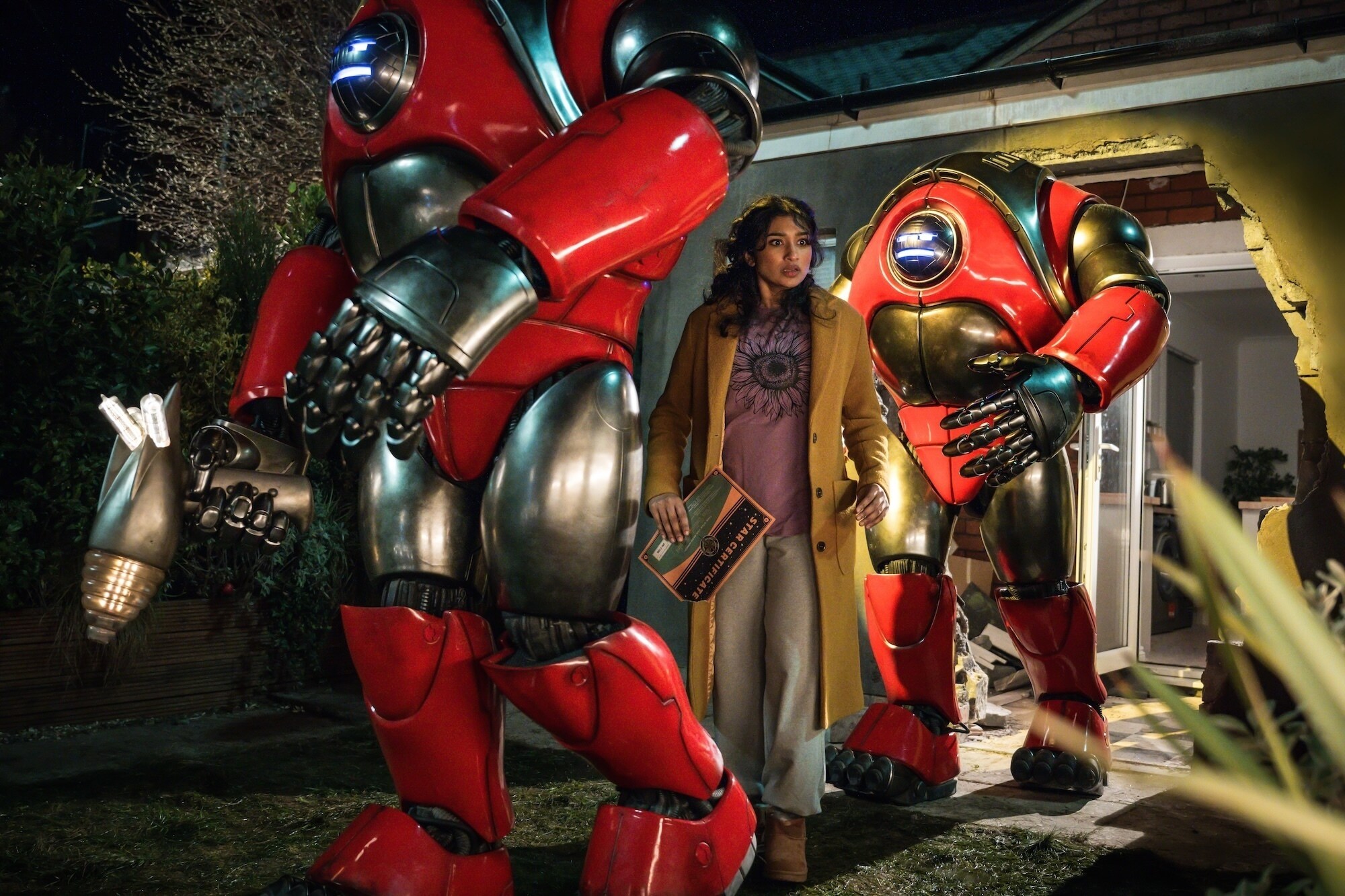 Picture Shows: Robot and Belinda Chandra (Varada Sethu) Lara Cornell/BBC Studios/Disney/Bad Wolf