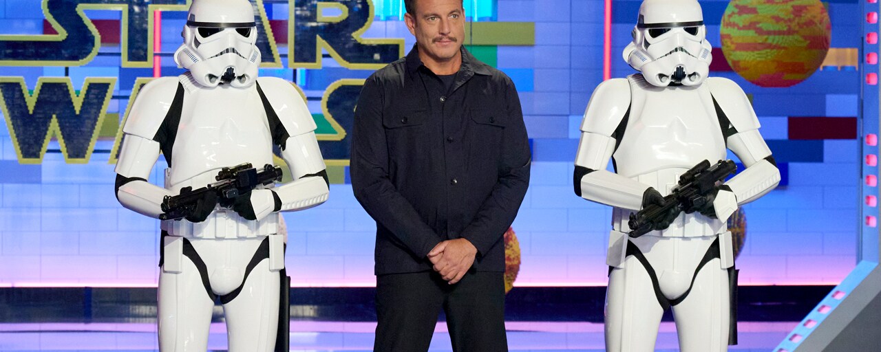 LEGO Masters host Will Arnett and stormtroopers welcome the contestants.