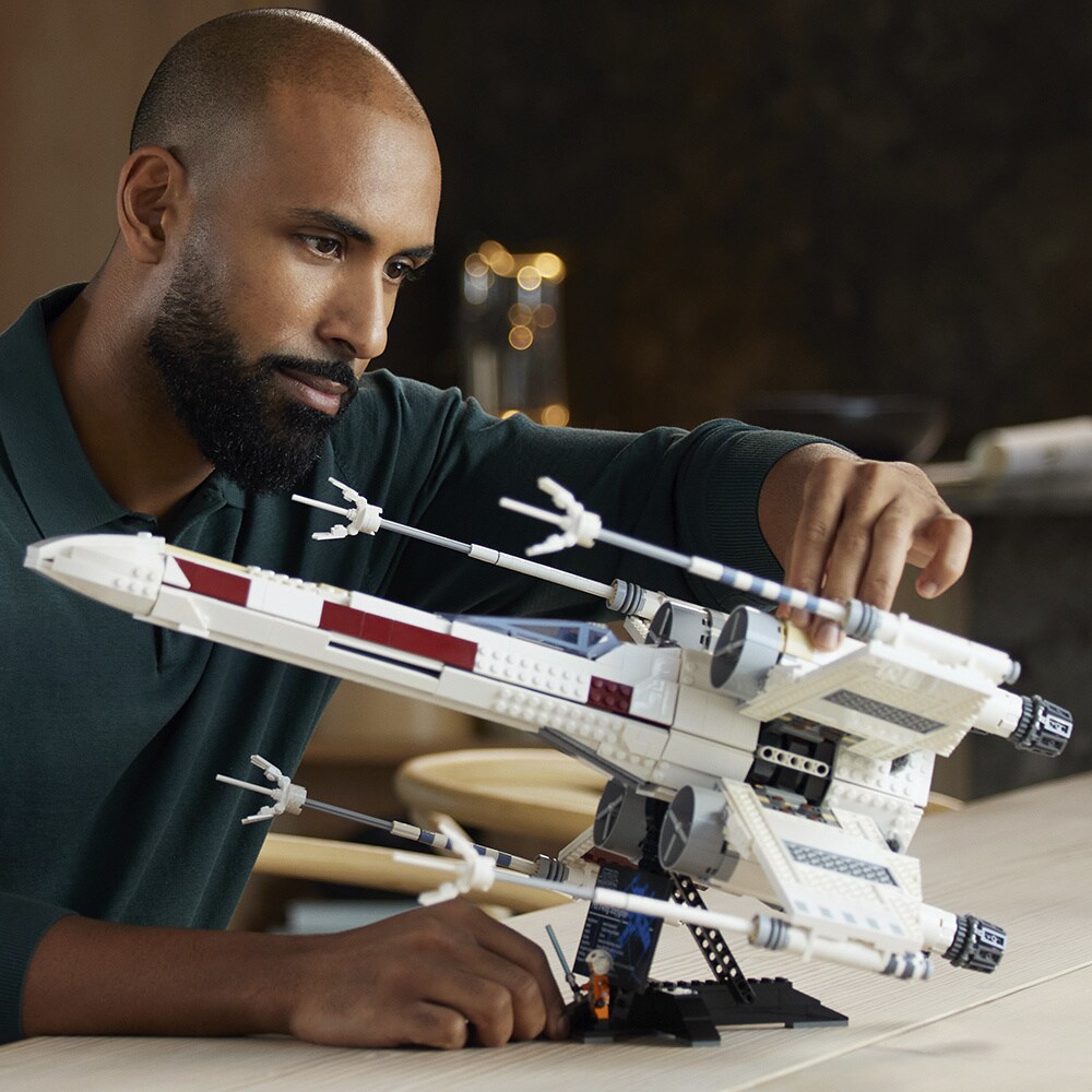 The LEGO Star Wars Ultimate Collector Series X-Wing Starfighter being built