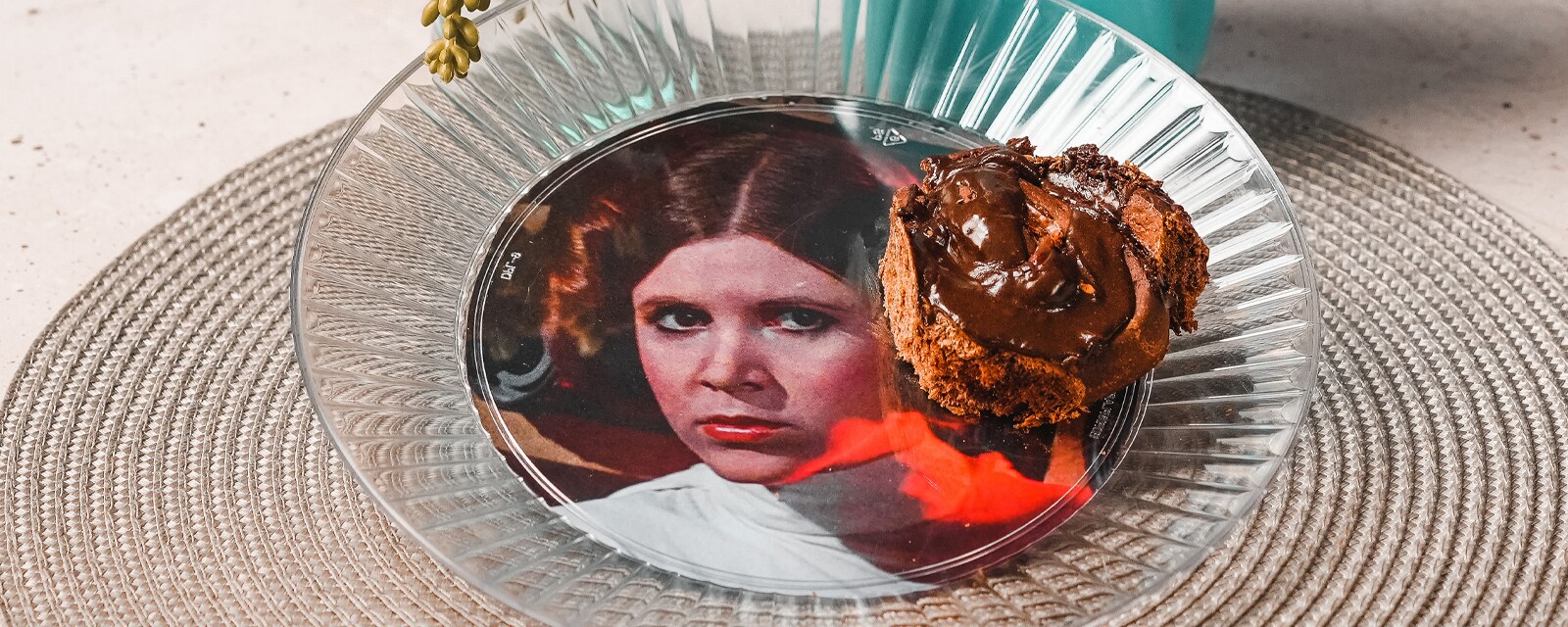 A Princess Leia Dessert Bun snack on a Princess Leia plate.