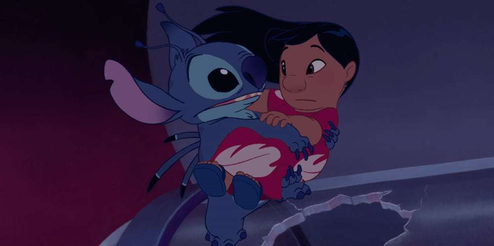 Stitch carrying Lilo in the animated movie "Lilo & Stitch"