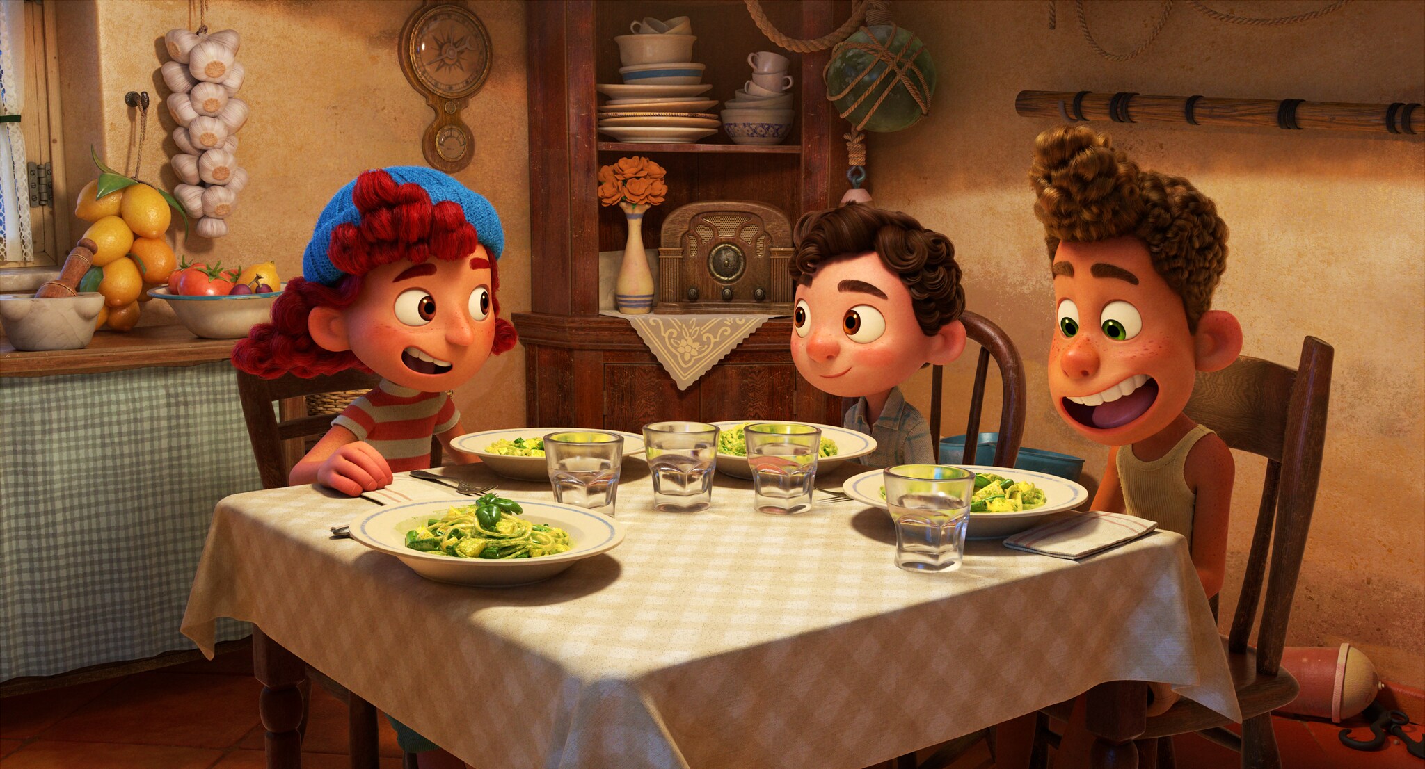 Luca, Alberto, and Guilia eat pasta