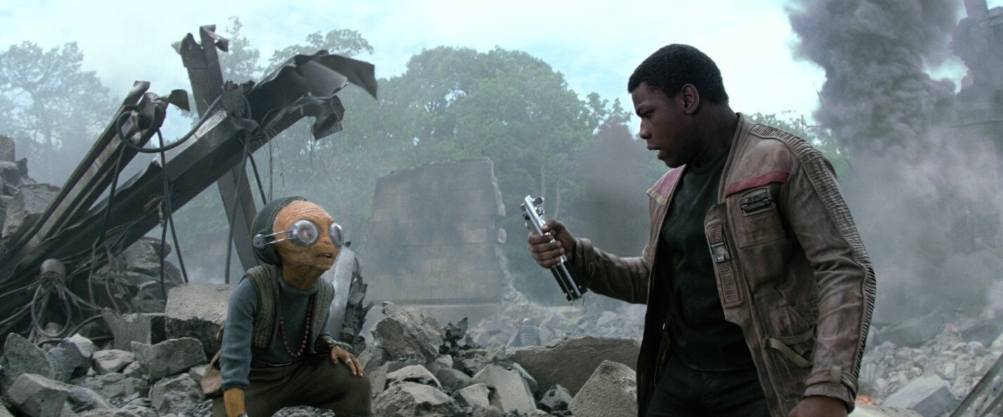 Maz Kanata instructing Finn to use the Skywalker lightsaber against the First Order on Takodana