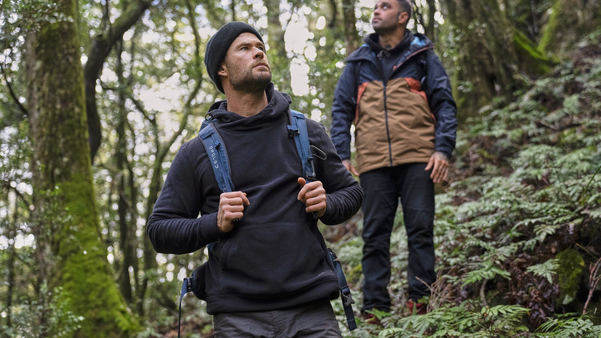 Chris Hemsworth and Otis Carey look out over the trail. (National Geographic for Disney+/Craig Parry)