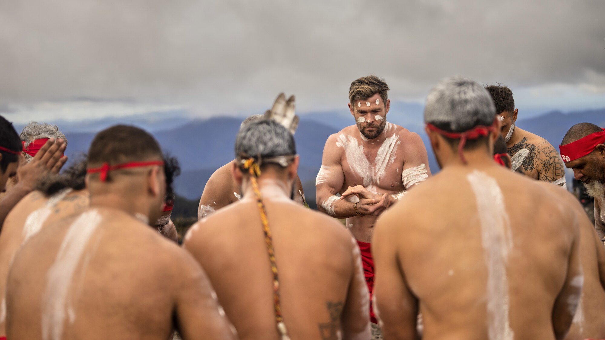 Chris Hemsworth smiles during a ceremony with the first nation's tribe. (National Geographic for Disney+/Craig Parry)
