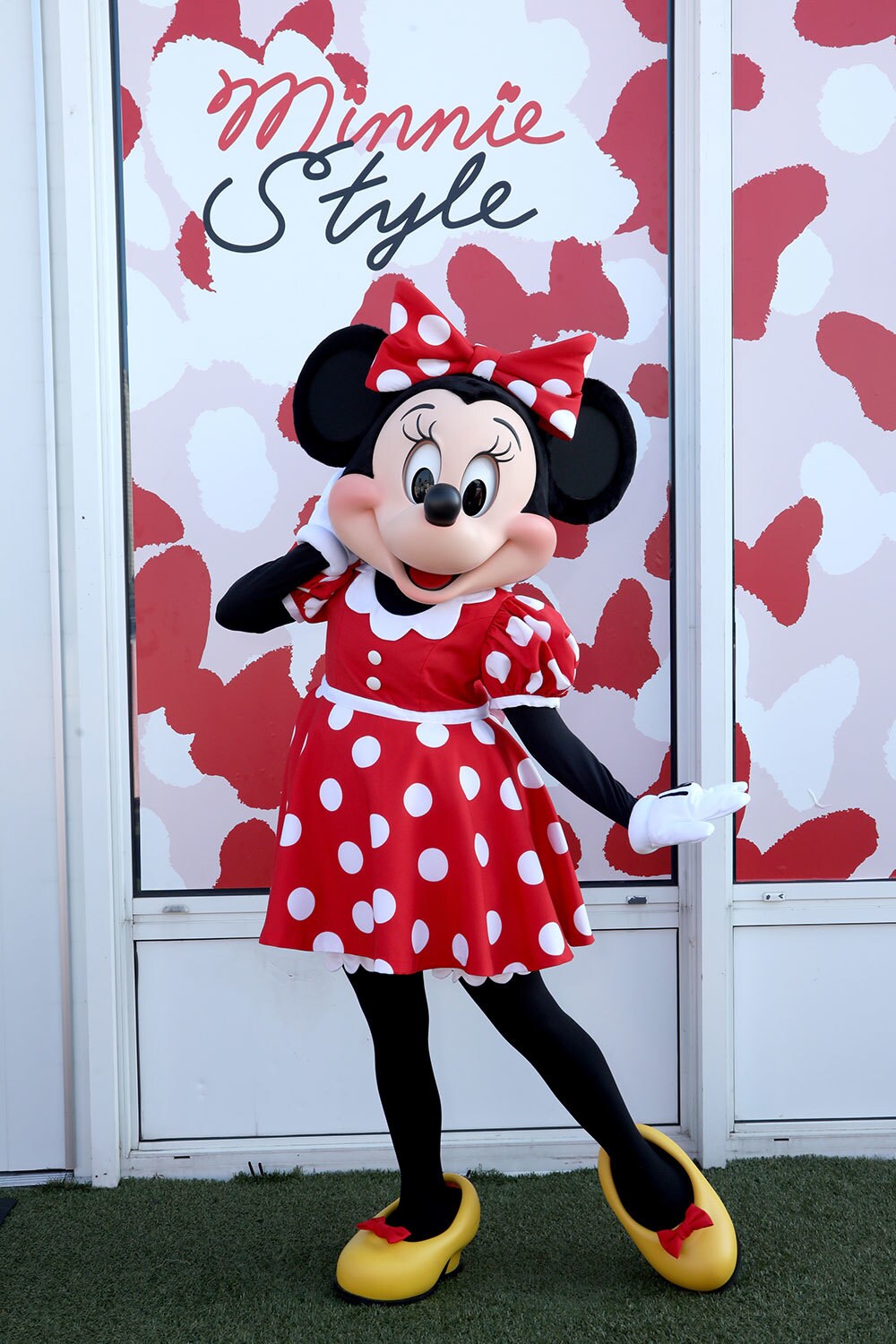 Minnie Mouse posing for a picture at the Minnie Style Suite