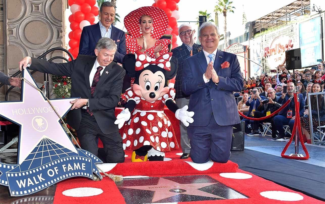 Bob Iger and Minnie Mouse celebrate receiving an official star on the Hollywood walk of fame