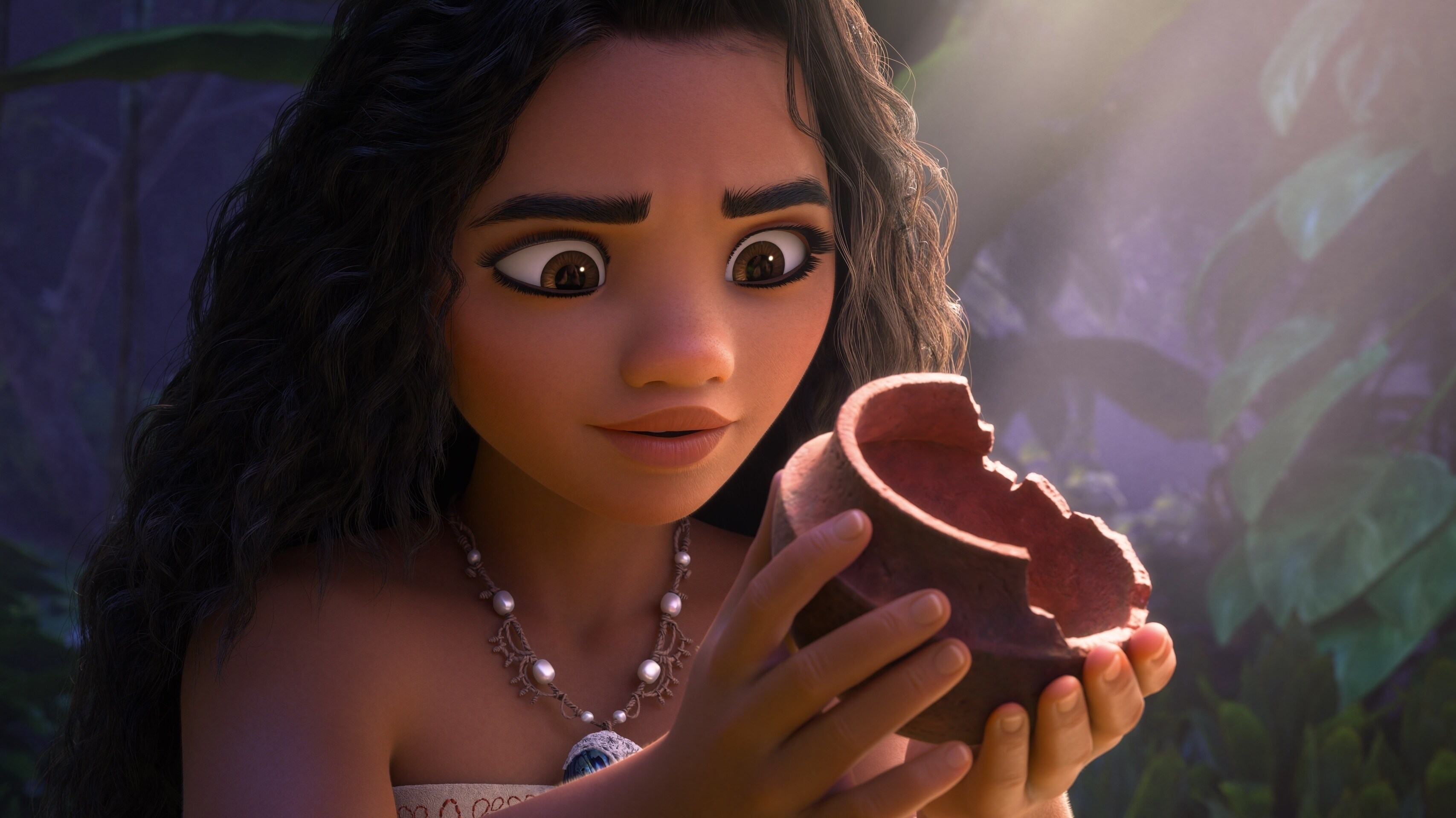 Image of Moana glancing at an object from Walt Disney Animation Studios’ movie, “Moana 2”. © 2024 Disney Enterprises, Inc. All Rights Reserved.