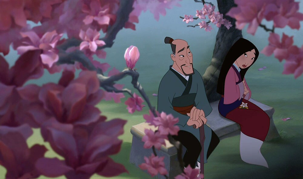 Animated Characters Mulan and Fa Zhou sitting together on a bench