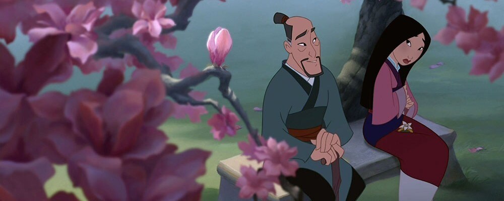 Mulan and Fa Zhou sitting together on a bench