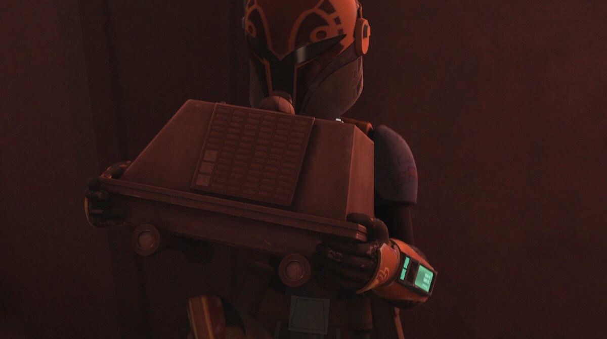 Sabine Wren holding a mouse droid