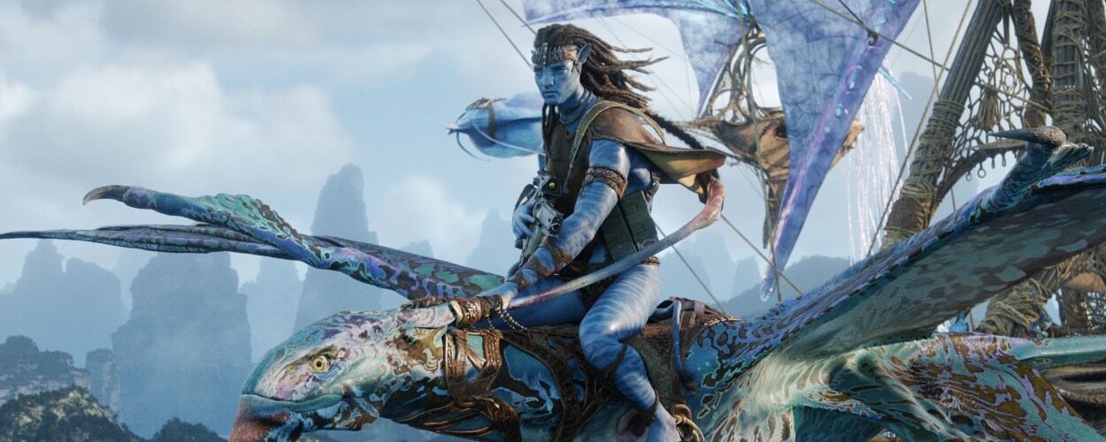 Jake Sully flies through the skies of Pandora on a winged creature in Avatar: Fire and Ash, gripping its reins with focus and determination.