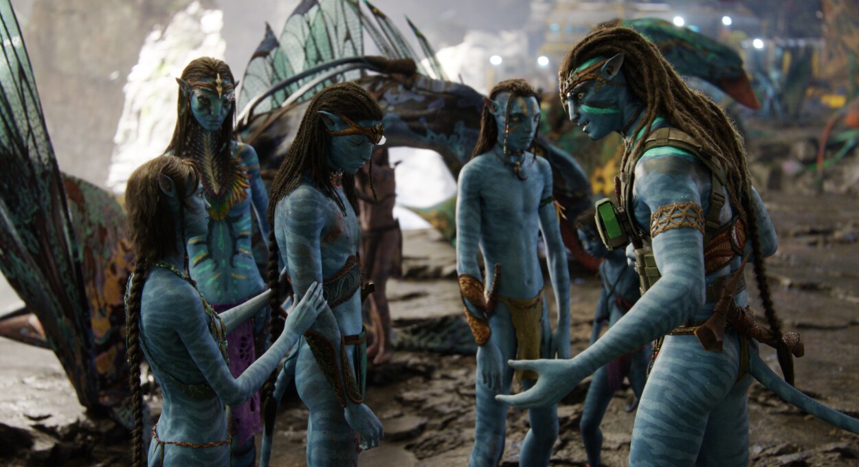 The Sully family stands together, talking forlornly.
