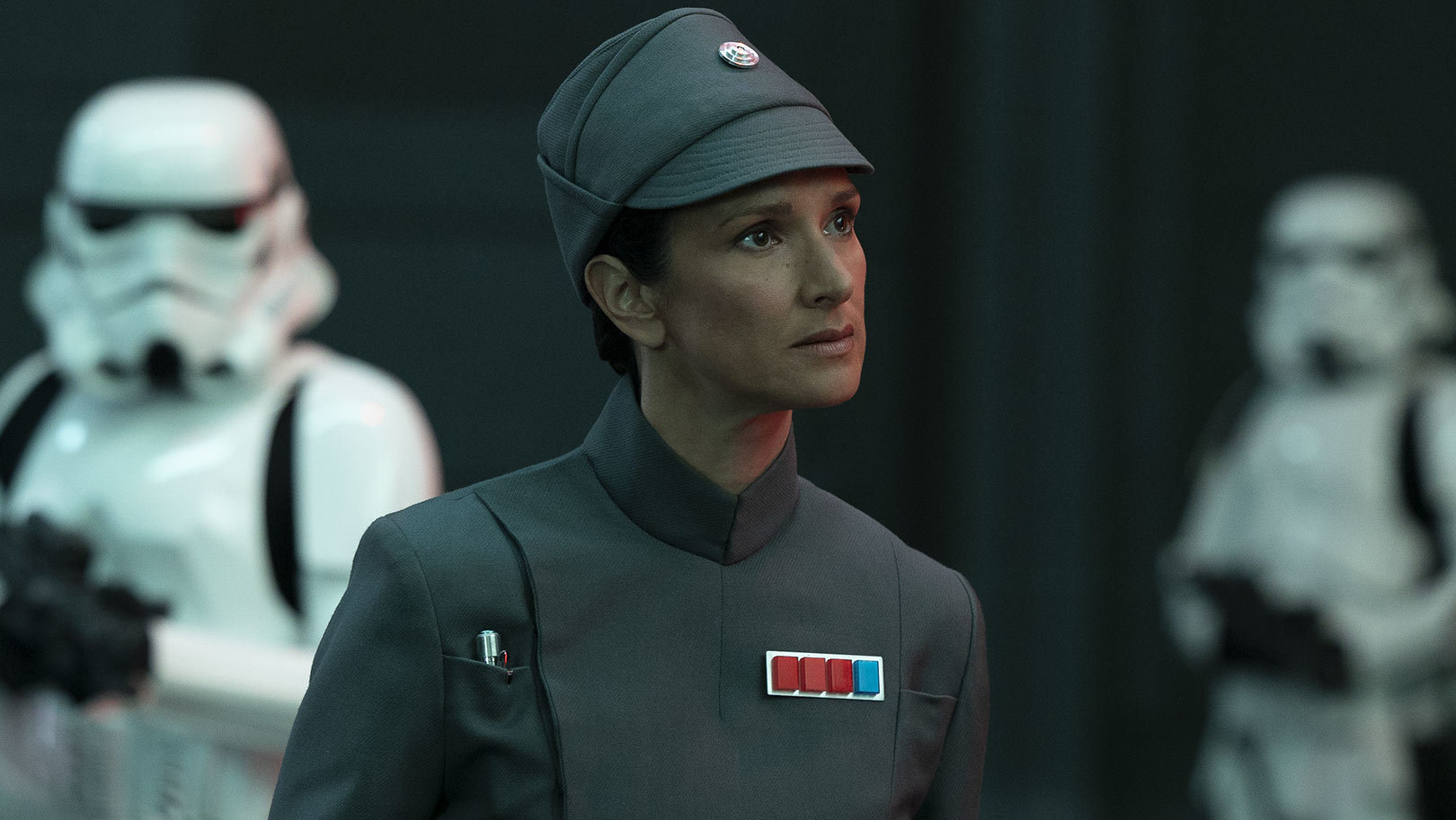 Tala, in her Imperial uniform, and Obi-Wan arrive at the Imperial headquarters. Tala passes throu...