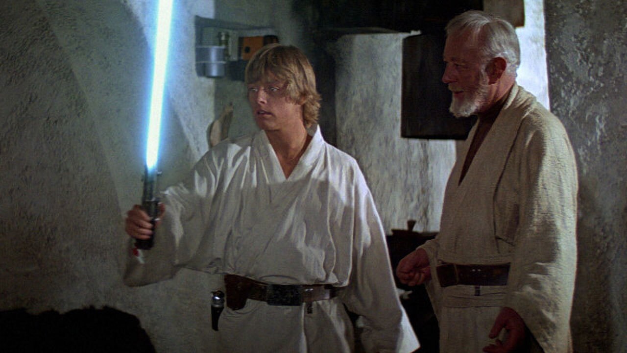 Obi-Wan giving Luke the Skywalker lightsaber