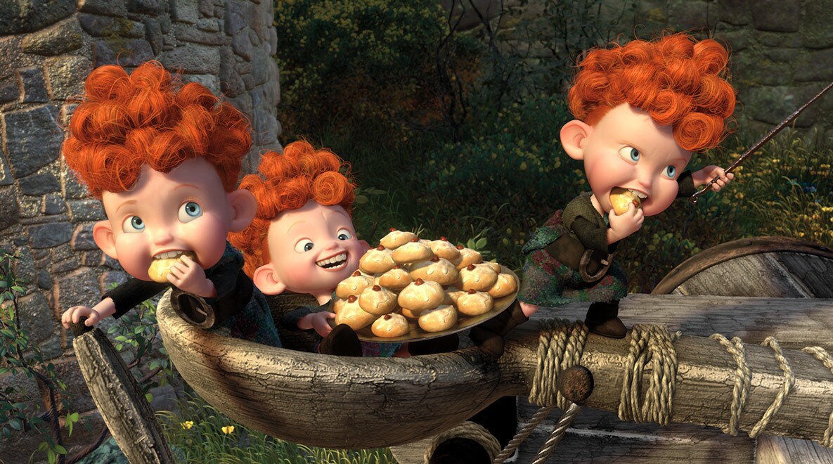 The triplets, Harris, Hubert, and Hamish, eating cookies in the movie Brave