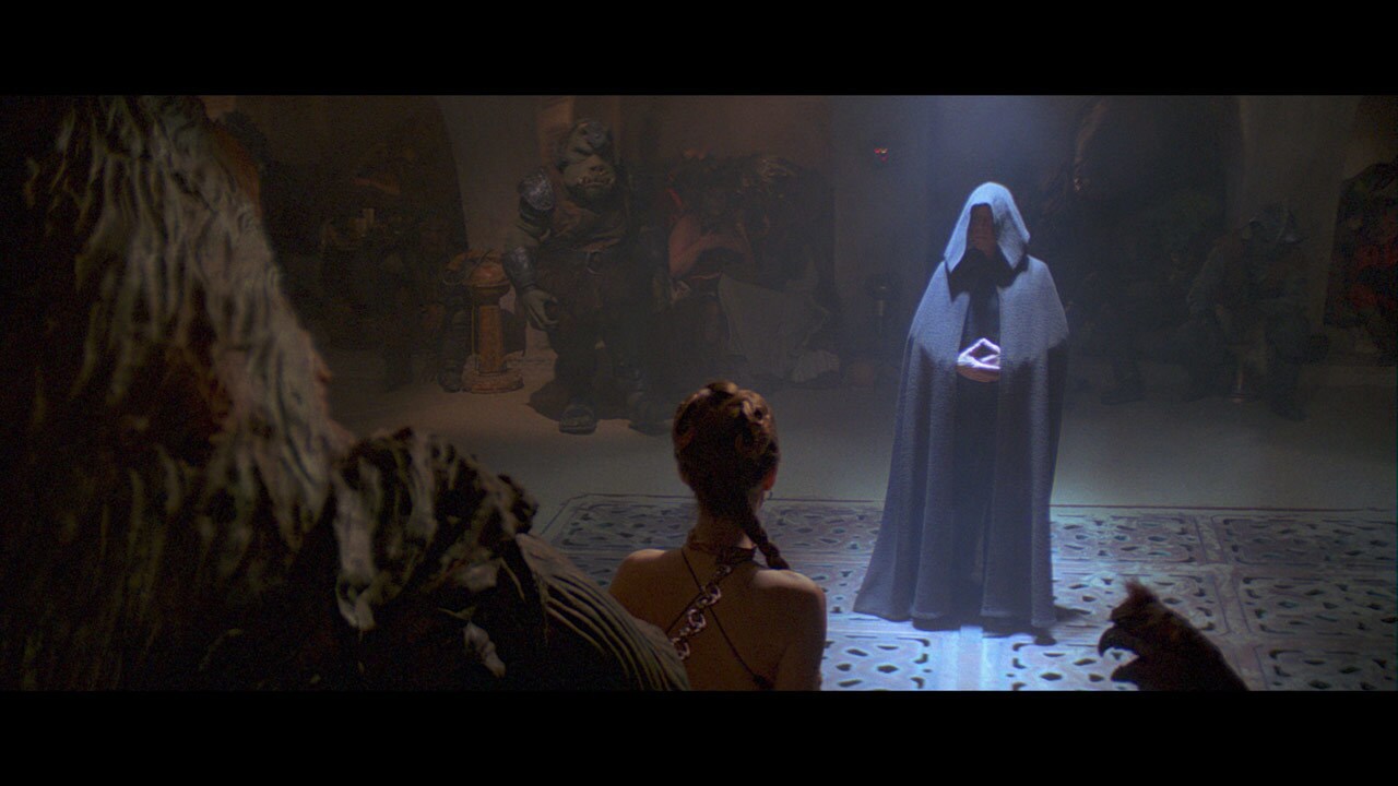 Leia is clad in a revealing gold costume -- a trophy in Jabba's court -- when Luke Skywalker appe...