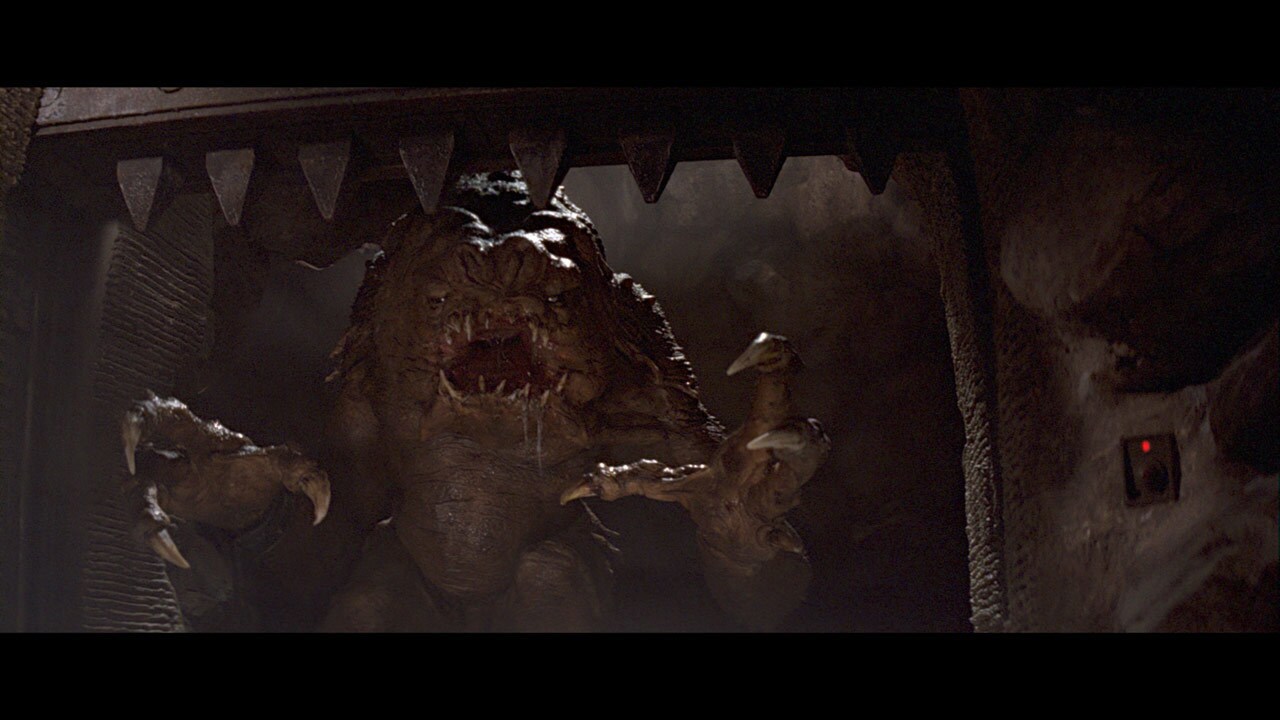 The rancor -- an enormous beast with flesh-tearing claws and teeth -- moves to eat the young Jedi...
