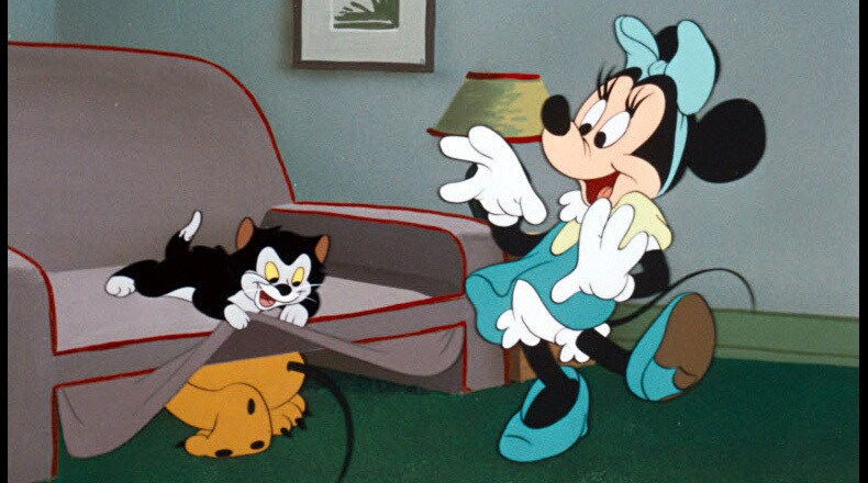 With help from Figaro, Minnie finds Pluto hiding under the couch.