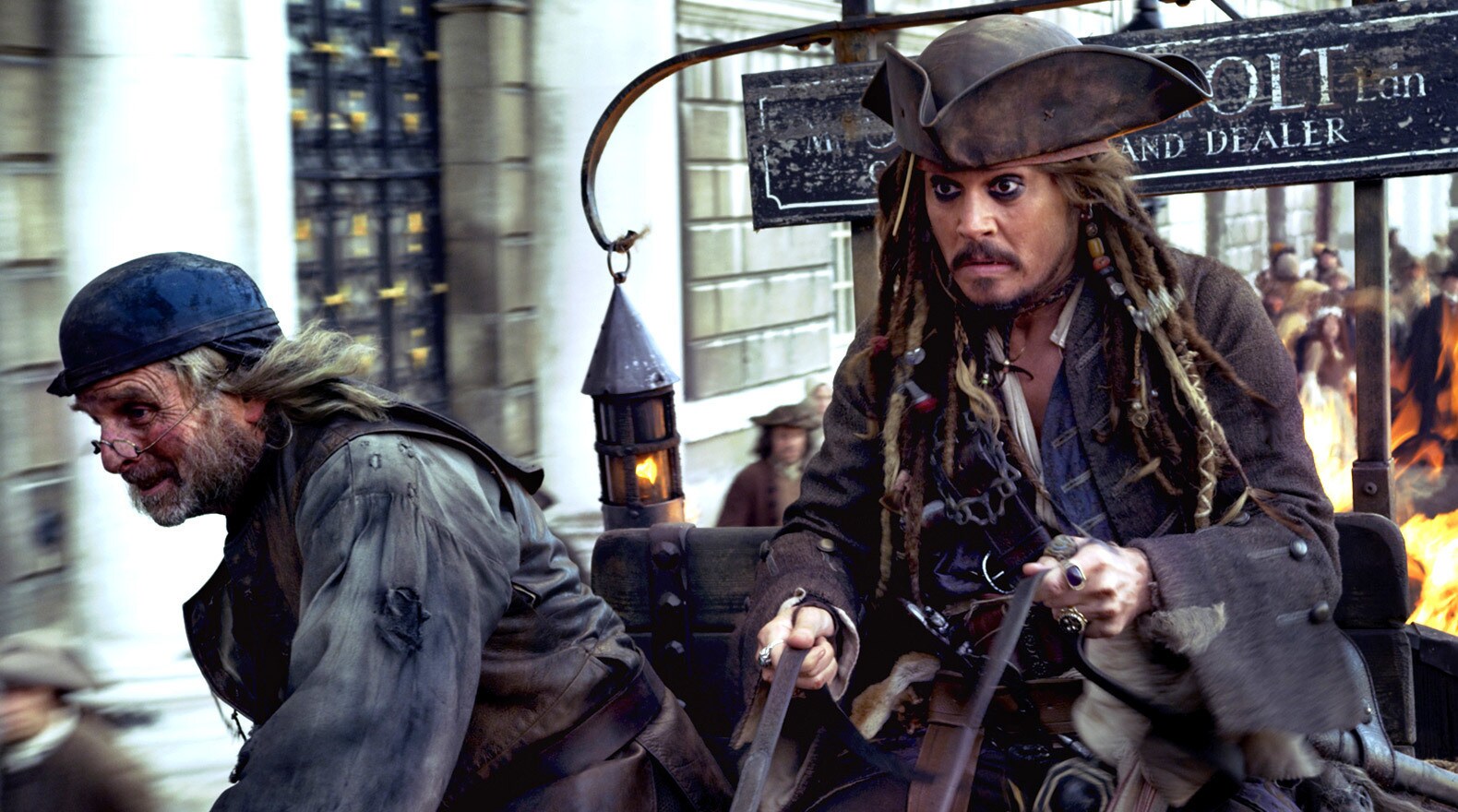 Jack Sparrow rides through London to escape from King George's royal guards.