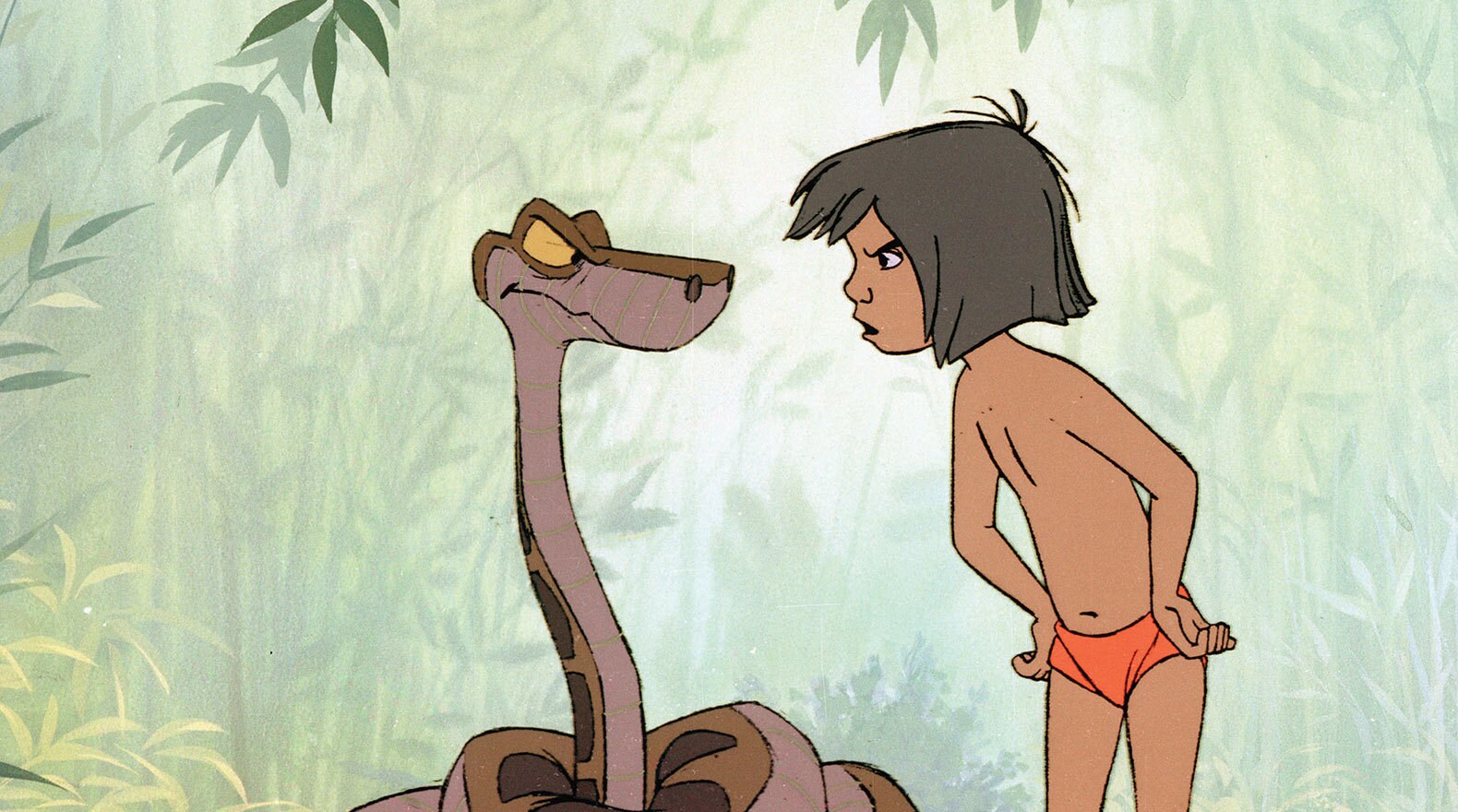 "Just you wait till I get you in my coils!" Kaa (voice of Sterling Holloway) and Mowgli (voice of Bruce Reitherman) from the Disney movie The Jungle Book (1967). 