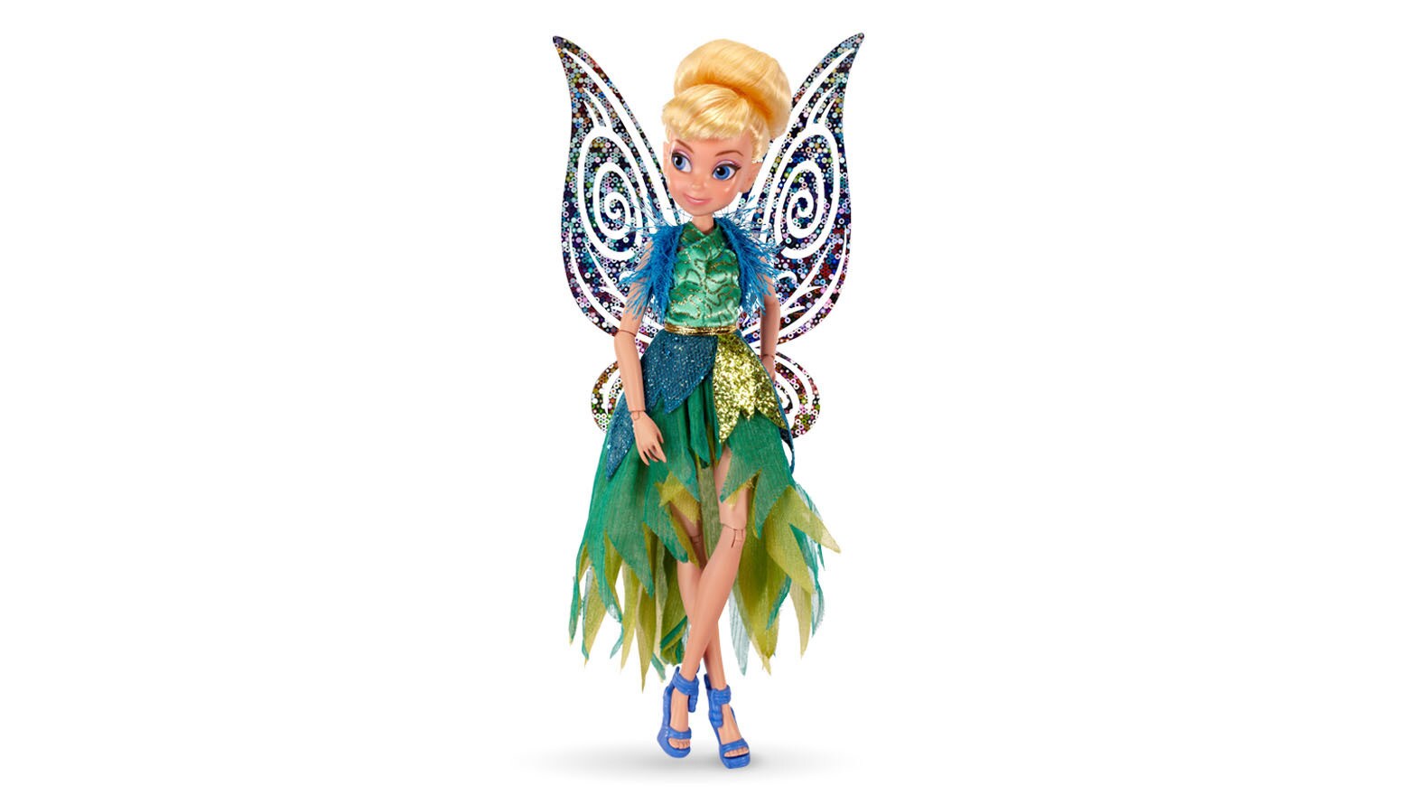 Tink is dressed to dazzle in a gown of green ferns and feathers embellished with tiny vines and d...
