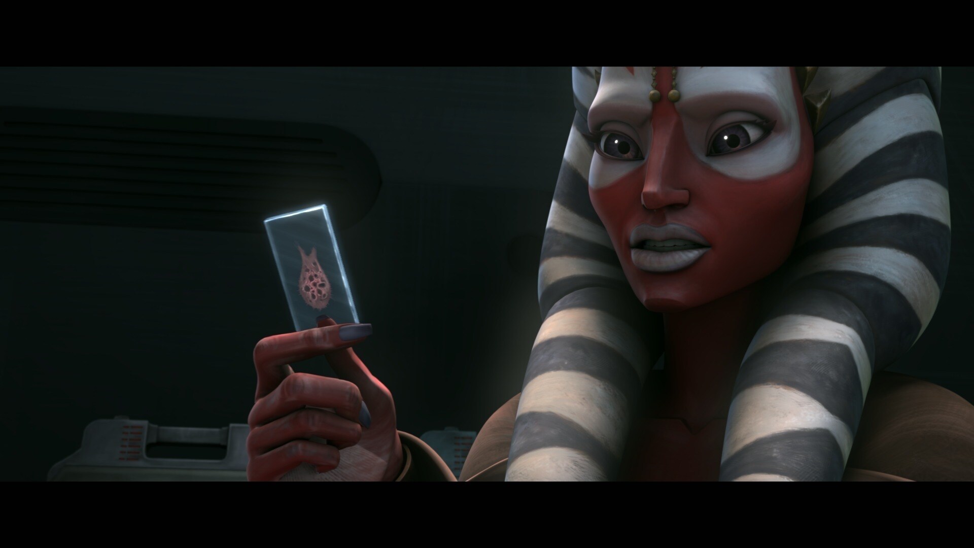 Fives sits under guard in a Kaminoan observation room. Shaak Ti informs him that the tumor and al...