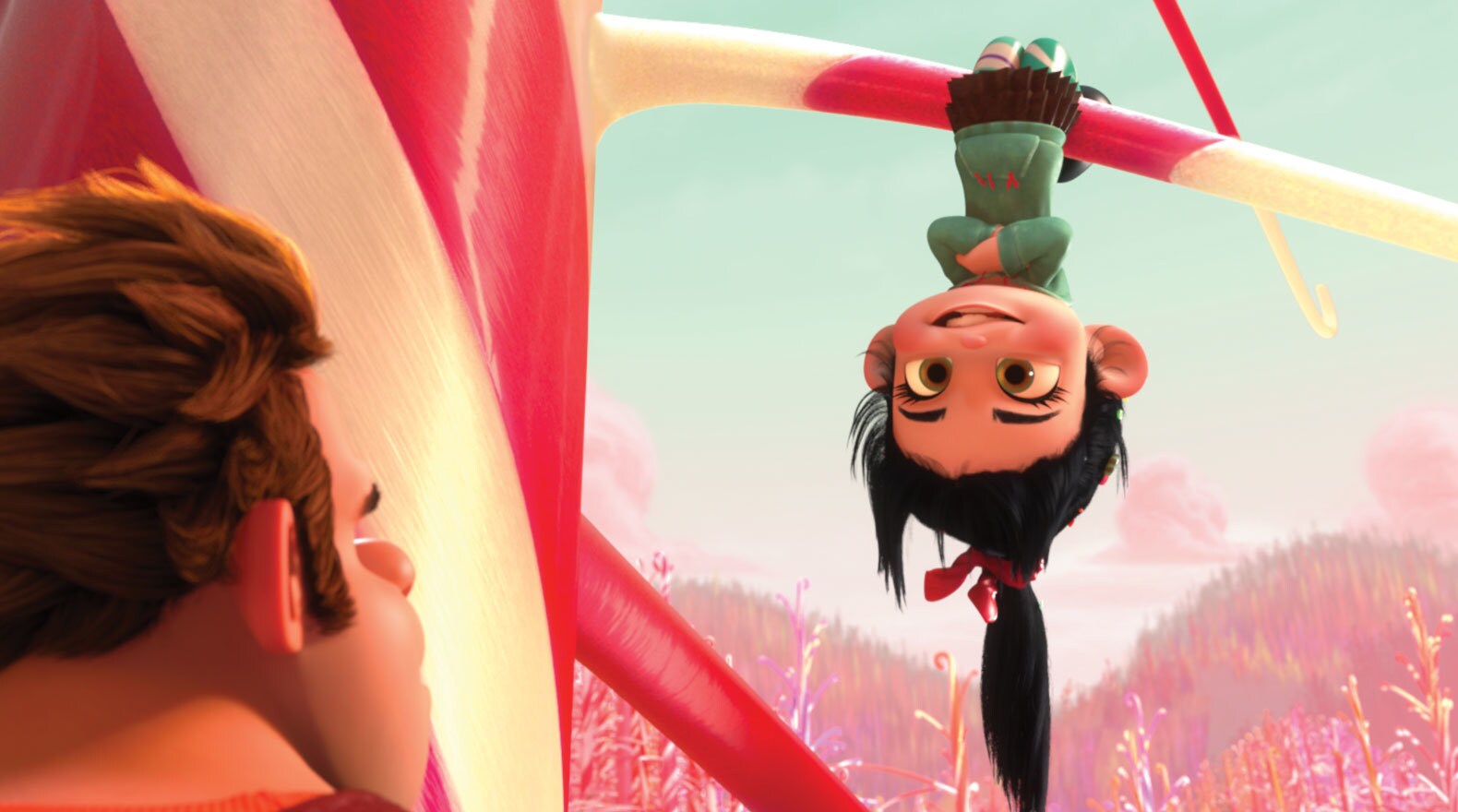 Sarah Silverman as Vanellope hanging upside-down looking at Ralph, played by John C. Riley in "Wreck-It Ralph"