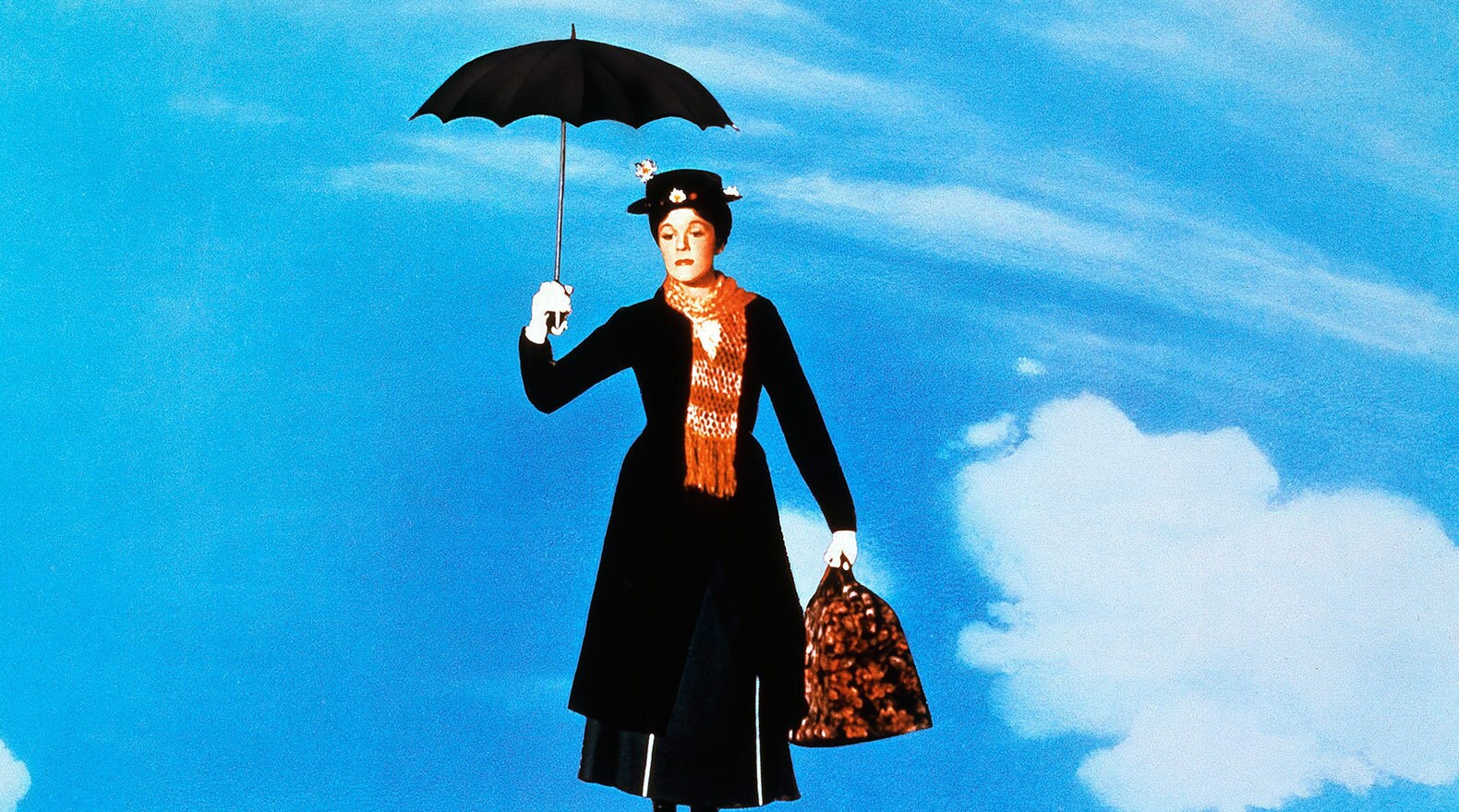 Mary Poppins flies off on her umbrella, to help another family in "Mary Poppins"