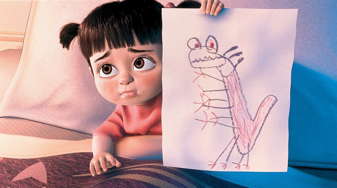 A sad Boo in bed holding a picture she drew of Randall 