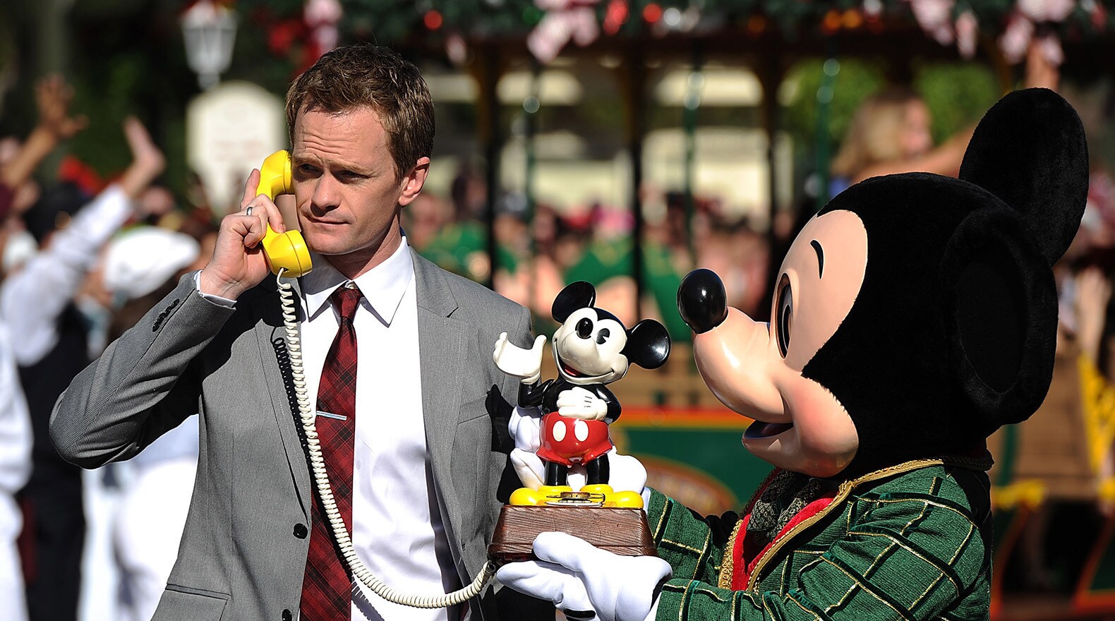 Host Neal Patrick Harris and a festive Mickey Mouse film a scene for The Disney Parks Christmas D...