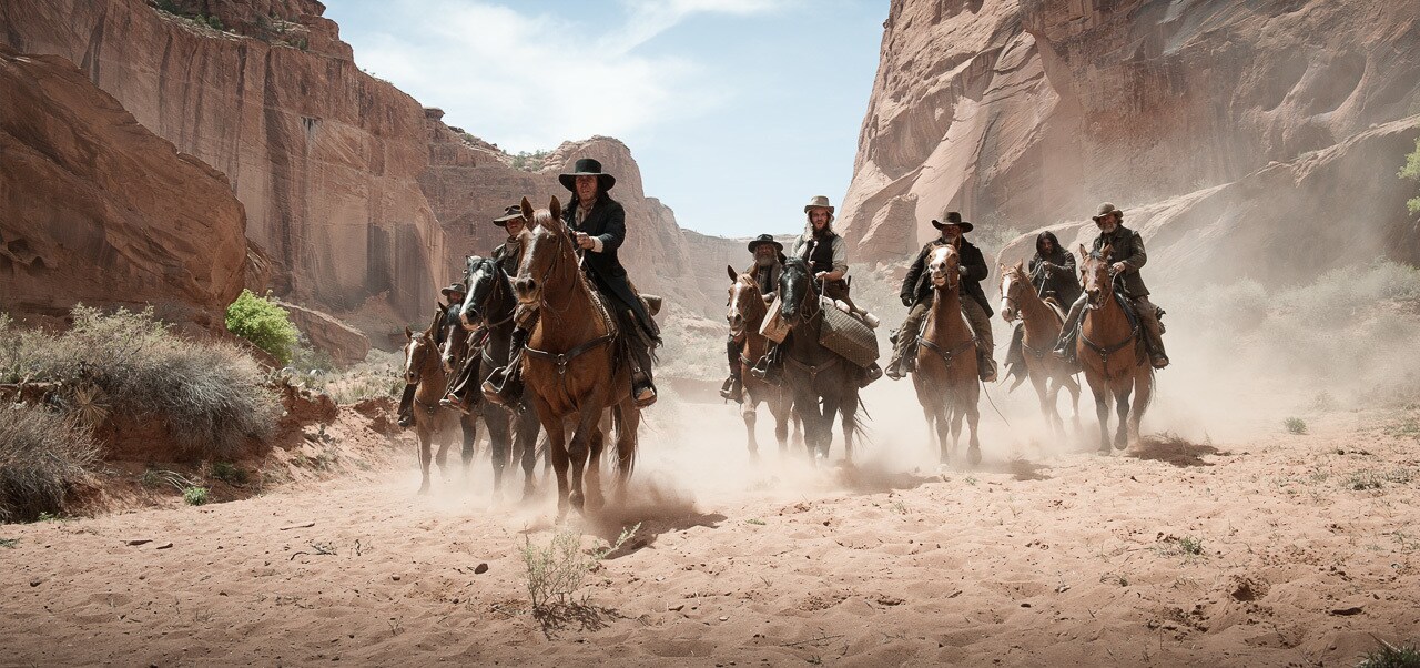 Image of a group of outlaws riding on horse back from the movie "The Lone Ranger"