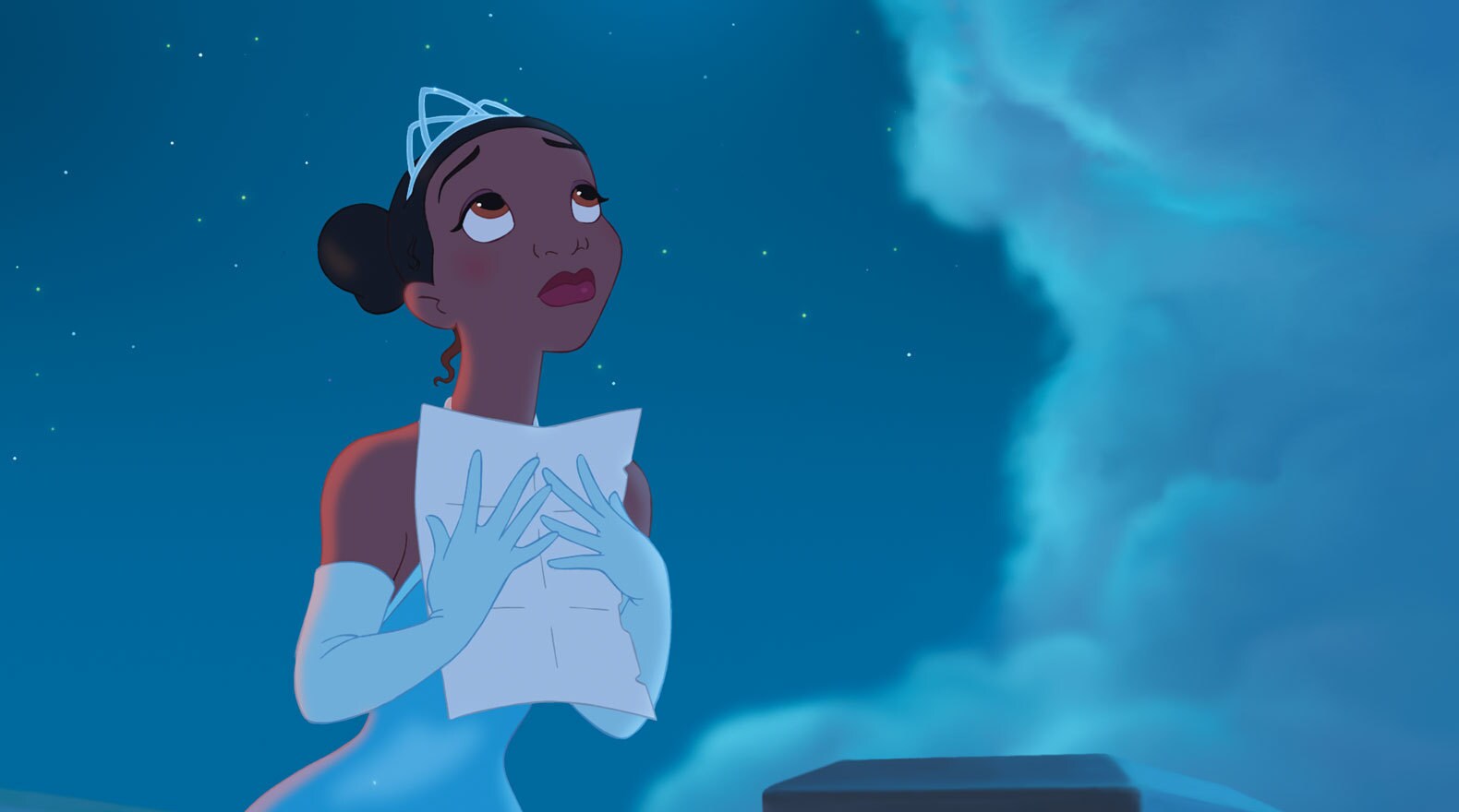 Tiana clutches a letter to her chest