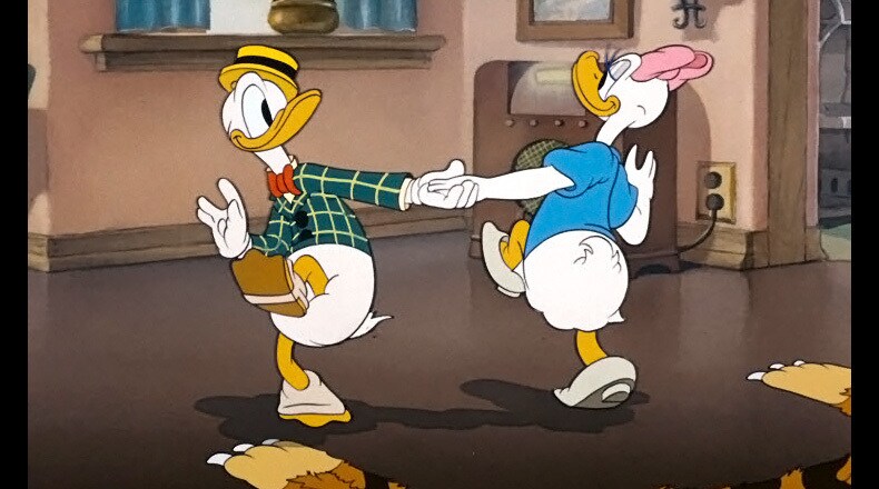 Donald and Daisy cutting a rug in the living room.