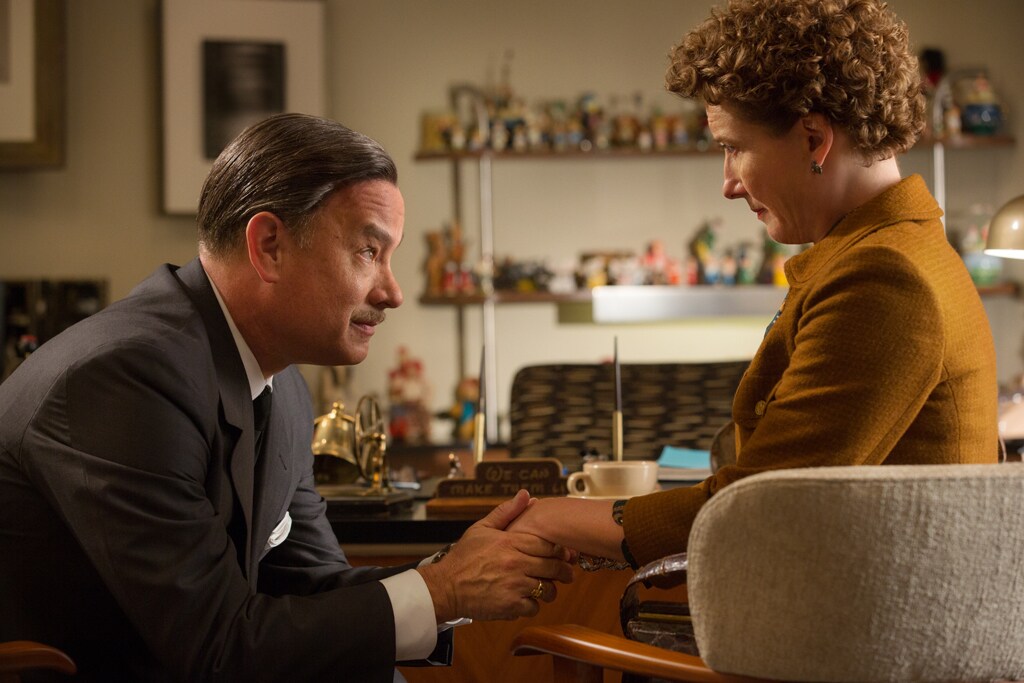 Actor Tom Hanks (as Walt Disney) holds the hand of Emma Thompson (as P.L. Travers) in the movie "Saving Mr. Banks".