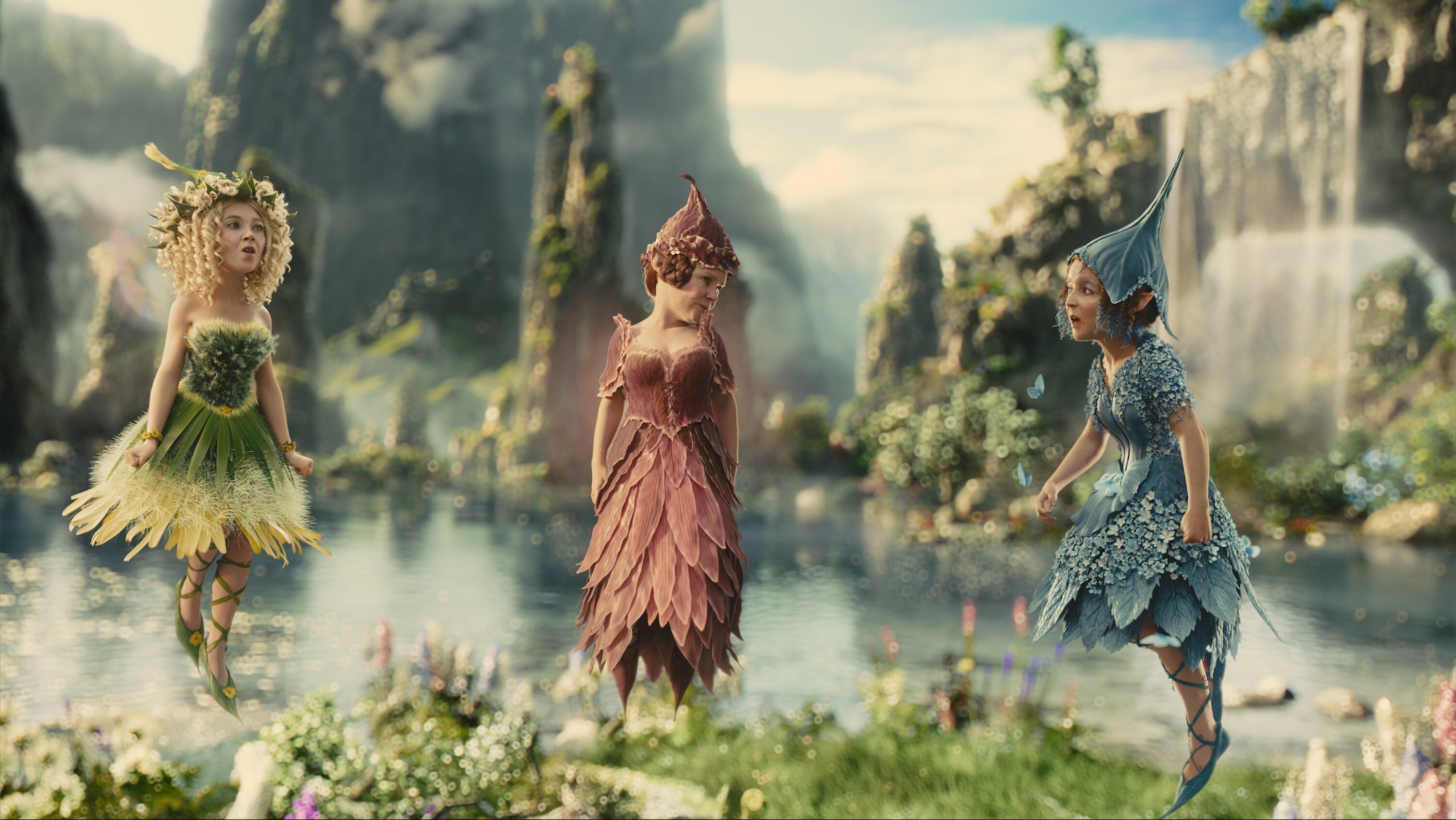 The three flower pixies, Knotgrass (played by Imelda Stauton), Flittle (played by Lesley Manville), and Thistlewhit (played by Juno Temple) in the movie "Maleficent"