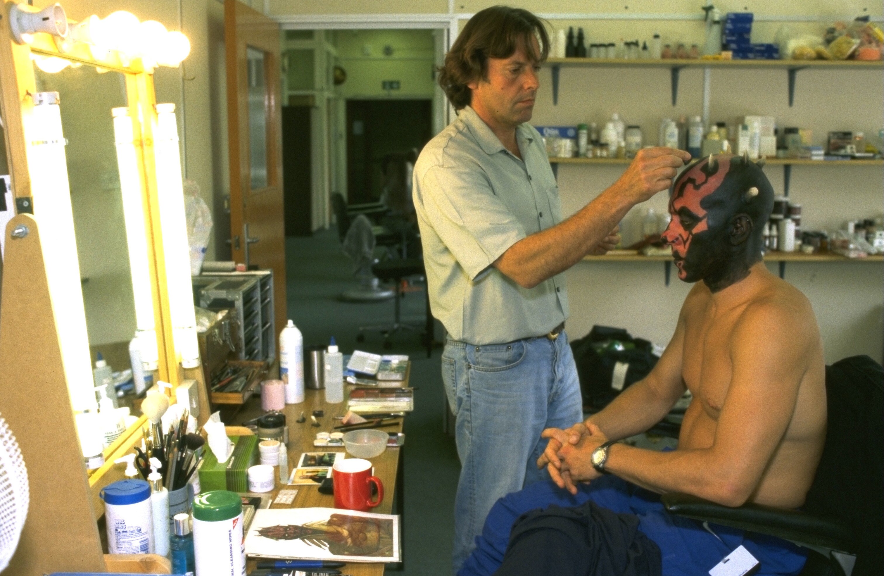 Ray Park sits for his Darth Maul makeup. 