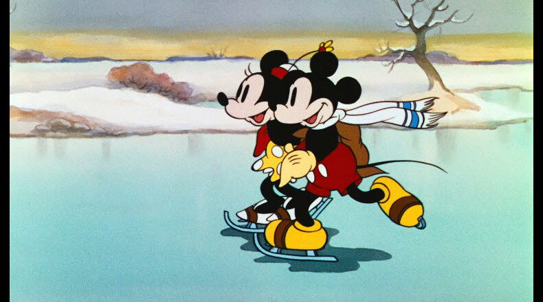 Minnie and Mickey take a spin on the ice.