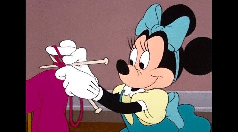 Minnie in the process of knitting a sweater for her pal Pluto.