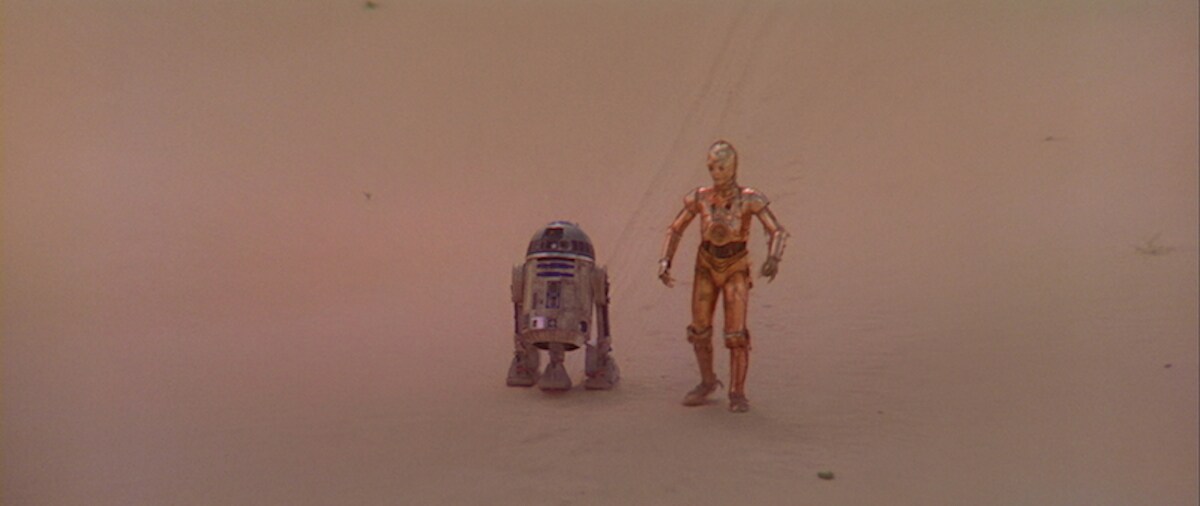 R2-D2 and C-3PO traversing the Jundland Wastes