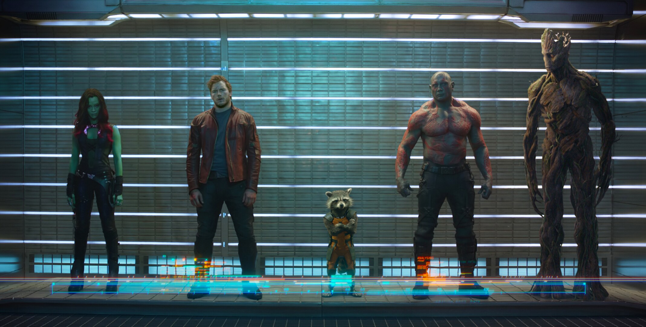 Zoë Saldaña as Gamora, Chris Pratt as Quill, Bradley Cooper as Rocket (Raccoon), Dave Bautista as Drax, and Vin Diesel as Groot imprisoned