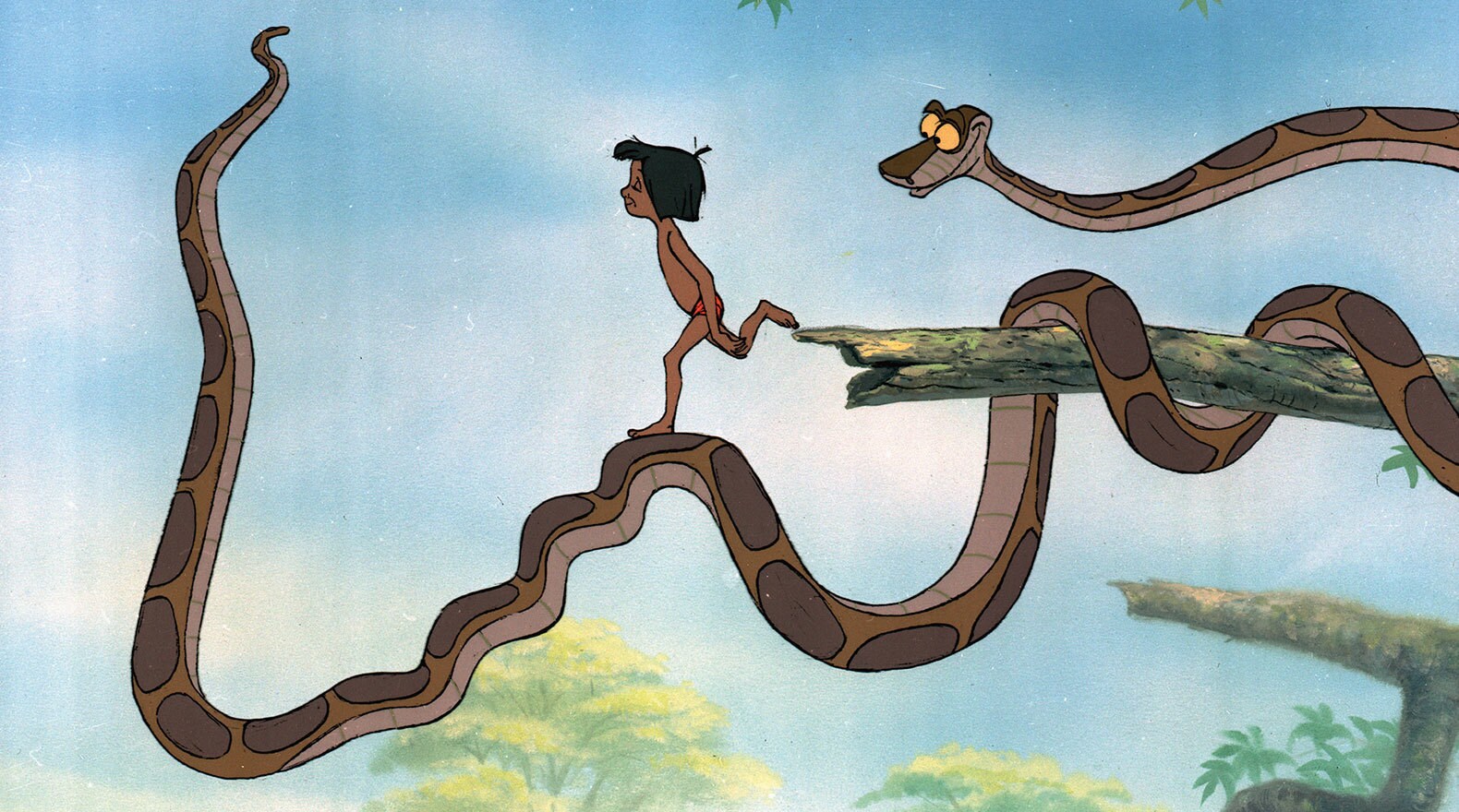 Mowgli is under Kaa's hypnotic spell.