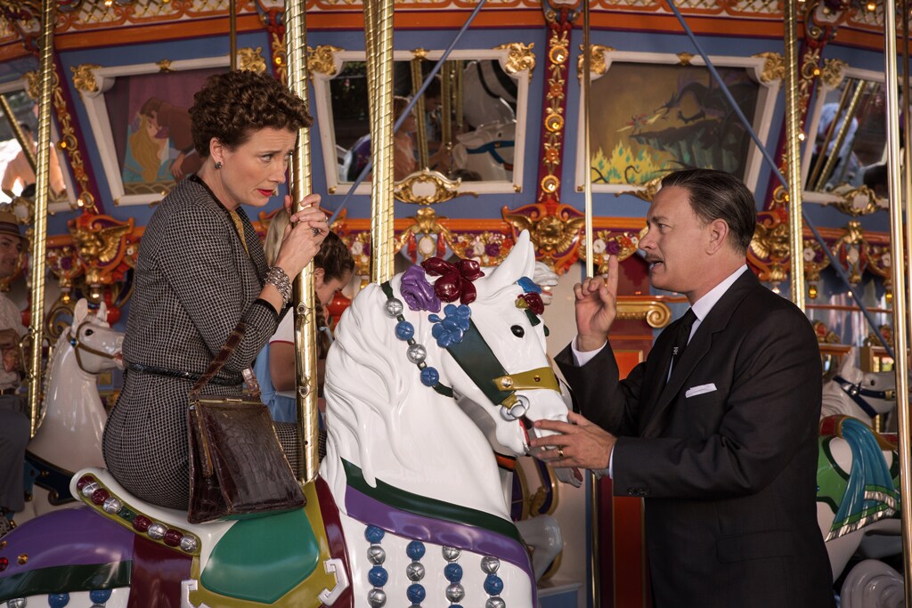 Actors Tom Hanks (as Walt Disney) and Emma Thompson (as P.L. Travers) riding a carousel in the movie "Saving Mr. Banks".