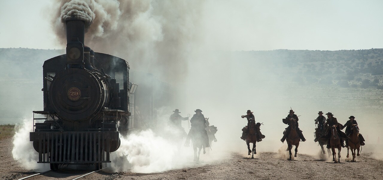 A group of outlaws approaching a moving train from the movie "The Lone Ranger"