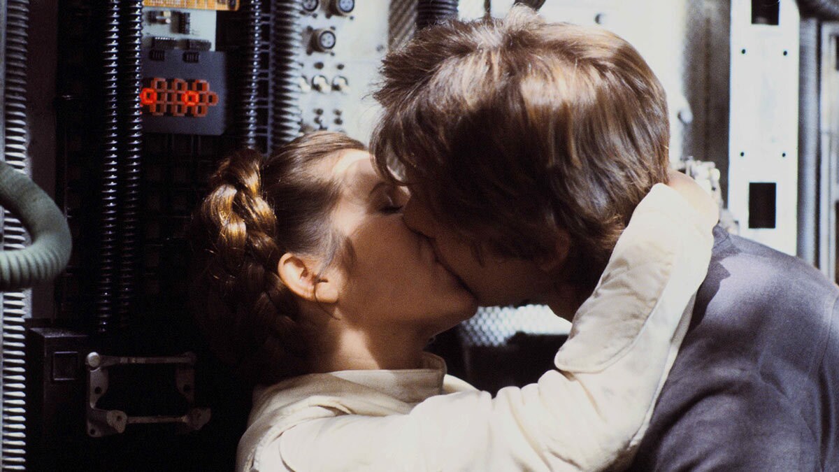 Princess Leia kissing Han Solo on the Millennium Falcon