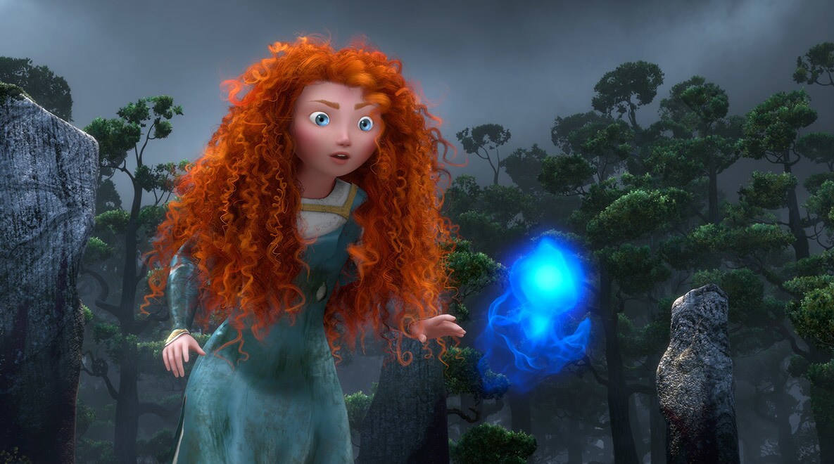Merida, voiced by Kelly Macdonald, in the highlands looking at a blue Wisp in the movie Brave