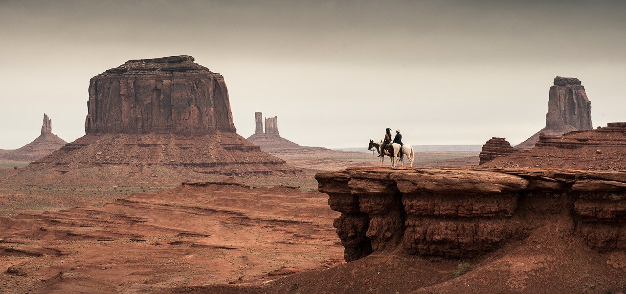 Tonto and the Lone Ranger looking towards the west in the movie "The Lone Ranger"