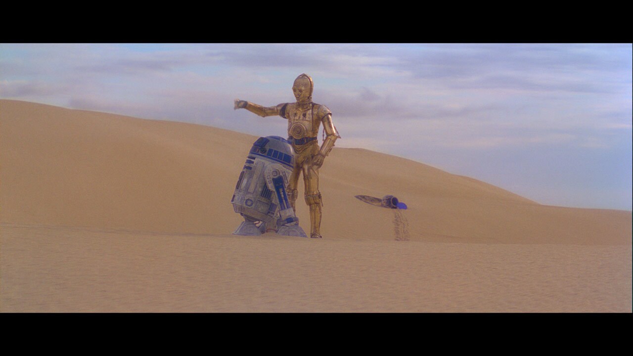 Parting ways, C-3PO wanders the endless dunes of Tatooine in search of a transport while R2-D2 he...